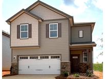 Charming two-story home with a two car garage and a welcoming covered porch at 278 Bezelle Ave, York, SC 29745