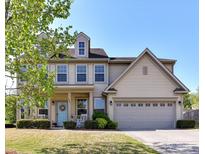 Charming two-story home featuring a welcoming front porch, manicured lawn, and a two-car garage at 3041 Hawick Ln, Fort Mill, SC 29707