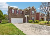 Attractive two-story brick home with a spacious driveway and manicured front yard at 620 Millstream Dr, Rock Hill, SC 29732