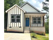 Charming new construction home featuring a modern design and a welcoming blue front door at 2350 14Th Street Ne Ct, Hickory, NC 28601