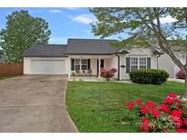 Charming single Gathering home featuring a lush front yard, fresh landscape and an attached two car garage at 105 Sterling Ter, Mooresville, NC 28115