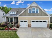 Charming two-story home with a landscaped front yard and a two-car garage, perfect for Gathering living at 1497 Tranquility Blvd # 417, Lancaster, SC 29720