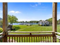 Breathtaking lake view from the balcony overlooking lush lawns and a serene harbor at 18700 Nautical Dr # 203, Cornelius, NC 28031