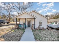 This house offers charming curb appeal with its inviting porch and manicured lawn, a perfect welcome at 705 Sumter St, Lancaster, SC 29720