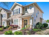 Charming home with stone accents, black shutters, and a beautifully landscaped front yard at 8524 Sunset Hill Rd, Waxhaw, NC 28173