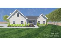 Charming home featuring bright siding, a dark roof, and complemented by lush landscaping and vibrant green lawns at 3605 Libby Ln, Midland, NC 28107