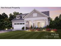 Charming single-Gathering home featuring a welcoming front porch and a two-car garage with meticulous landscaping at 41 Five Creek Rd # 41, Charlotte, NC 28213