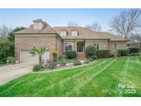 Charming brick home with well-manicured front yard and mature landscaping at 426 Saint Michaels Way, Fort Mill, SC 29708