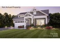 Charming two-story home with landscaped yard and gray siding; well manicured lawn at 46 Five Creek Rd # 46, Charlotte, NC 28213