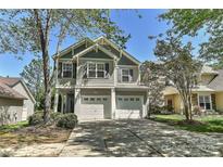 Charming two-story home with a two-car garage and inviting curb appeal at 1037 Hammond Dr, Matthews, NC 28104