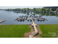 An aerial view of the lake, walking path, and boat slips at the condo community at 18700 Nautical Dr # 101, Cornelius, NC 28031