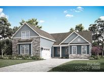 Beautiful exterior elevation featuring stone accents, blue siding, and a well-manicured lawn at 2085 Fordhill St, Rock Hill, SC 29362