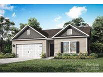 Charming single Gathering home featuring a two-car garage, landscaped front yard and a classic, inviting facade at 3338 Strong Box Ln, Gastonia, NC 28052