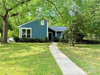 Charming one-story home with a well-maintained lawn and inviting walkway at 11824 Larkridge Ct, Charlotte, NC 28226