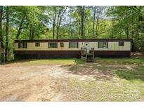 Spacious one-story home with a cozy front porch and large yard at 2275 Brown Creek Church Rd, Wadesboro, NC 28170
