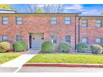 Charming brick townhouse with manicured lawn and inviting entrance at 266 Kelly St, Statesville, NC 28677