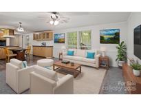 Bright living room featuring modern furniture, art, and ample natural light at 4757 Mountain View Ln, Maiden, NC 28650