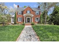 Charming brick home with a well-manicured lawn and inviting walkway, perfect for curb appeal at 528 1St Nw Ave, Hickory, NC 28601