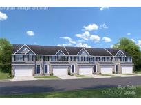 New construction townhome exterior featuring gray siding, white garage doors, and blue front doors at 7349 Childress Sw Dr, Concord, NC 28025