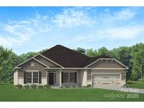 Charming single-story home featuring a two-car garage, well-manicured lawn, and traditional architectural details at 1035 Gardenia Dr # 51, Mt Ulla, NC 28125
