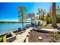 Lakeside patio with seating and panoramic views of the water, perfect for relaxing at 6788 Bucleigh Rd, Clover, SC 29710