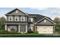 Charming two-story home featuring a manicured lawn and a two-car garage at 1465 Mocksville Hwy # 20, Statesville, NC 28625