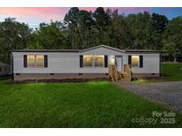 Charming single-story home with lush lawn and inviting entrance, perfect for comfortable living at 1649 Cloudburst Cir # 6, Lincolnton, NC 28092