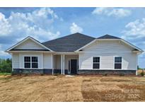 Charming single-story home with white siding and a well-manicured lawn at 228 Mountain Island Dr # 38, Statesville, NC 28677