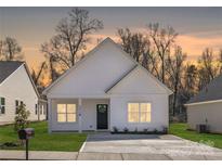 Charming single-story home with a well-maintained lawn and a welcoming entrance, perfect for first-time buyers at 4907 Victoria Ave, Charlotte, NC 28269