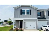 Charming exterior view with a gray facade, black door, and one car garage at 1760 Old Rivers Rd, Concord, NC 28027