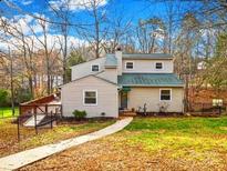 Charming two-story home with a welcoming front yard and a cozy deck, perfect for outdoor relaxation at 32 Heritage Ln, Shelby, NC 28150
