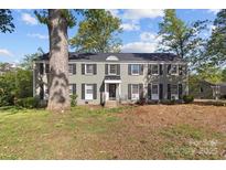 Traditional two-story home featuring gray paint, black shutters, and a well-manicured front lawn at 343 Wakefield Dr # C, Charlotte, NC 28209