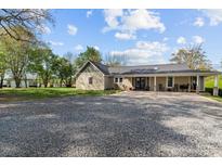Charming single-story home with a covered porch, gravel driveway, and well-maintained landscaping at 14855 Nc 801 Hwy Hwy, Mt Ulla, NC 28125