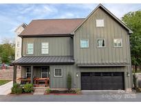 Charming two-story home featuring a two-car garage and inviting front porch at 1511 Landis Ave, Charlotte, NC 28205