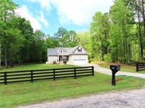 Charming single-Gathering home with well-maintained lawn and attached two-car garage at 2127 Cedar Rd, York, SC 29745