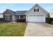 Charming single-Gathering home features a two-car garage, well-maintained lawn, and inviting curb appeal at 508 Danfield Dr, Clover, SC 29710