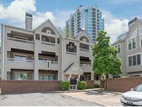 Attractive multi-story condominium building with balconies, brick accents, and manicured landscaping near downtown at 212 W 10Th St # 17, Charlotte, NC 28202