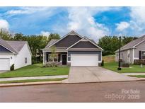 Charming single-Gathering home featuring a two-car garage and manicured lawn at 2219 Catawba Trace Dr, Catawba, NC 28609
