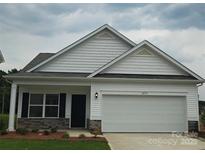 Charming single-story home with white siding, stone accents, and an attached two-car garage at 2219 Catawba Trace Dr, Catawba, NC 28609