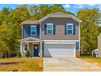 Charming two-story home featuring a front-facing garage, and lovely curb appeal at 320 Silver Oak Cir, Rockwell, NC 28138