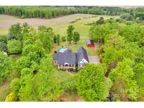 Expansive property featuring a house with a pool and lush landscaping at 3871 Cool Branch Dr, Maiden, NC 28650