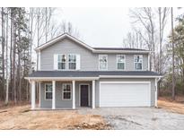 Charming two-story home with gray siding, white trim and a two car garage at 4149 River Run Cir, Hickory, NC 28602