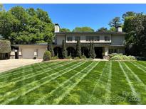 Stunning home with lush, manicured lawn, attached two-car garage, and verdant landscaping at 1816 5Th Nw St, Hickory, NC 28601