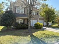 Charming two-story home featuring a two-car garage and a well-maintained front yard at 1104 Valley St, Statesville, NC 28677
