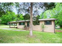 Charming brick home with well-maintained lawn and a welcoming front entrance at 134 Piedmont Dr, Kannapolis, NC 28081