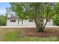 Charming brick home with manicured lawn and walkway leading to the front door at 1904 27Th Avenue Ne Dr, Hickory, NC 28601