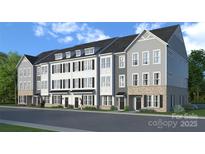 Modern townhome exteriors featuring multi-story facade with gray and white siding and brick foundations at 236 Wesser St # 3, Davidson, NC 28036