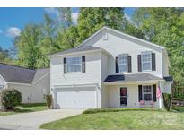 Charming two-story home featuring a two-car garage, neat landscaping, and a welcoming front porch at 599 Annalinde Ln, Rock Hill, SC 29732