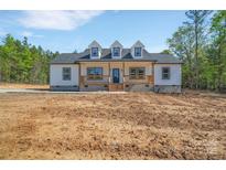 Charming one-story home with board and batten siding and a welcoming porch at 1119 Stanback Rd, Chester, SC 29730