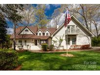 Charming two-story home with a manicured lawn and a welcoming American flag at 16 Catawba Ridge Ct, Clover, SC 29710